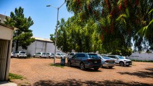a group of cars parked in a parking lot at Hotel Grand Elizabeth in Durango
