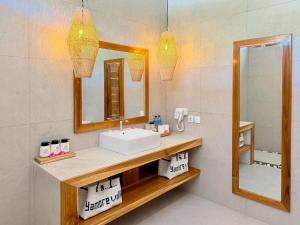 a bathroom with a sink and a mirror at Yamore Villa in Gili Islands +24 photos