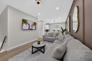 a living room with a couch and a table at The Windsor Mainstay in Windsor