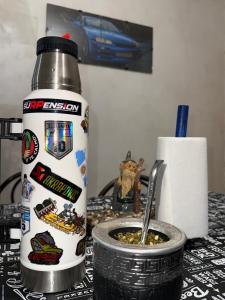a container of food with a spoon in it on a table at Runa Huasi in Tinogasta +2 photos