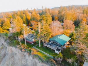 an aerial view of a house with a green roof at Private Blufftop Oceanview Hot Tub Fire Pit in Port Angeles