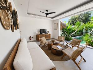 a living room with a white couch and chairs at Villa Mei 2BR Pool, 200m from Seseh Beach in Dalung
