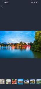 a picture of a lake with lights in the water at Omeli homestay in Hanoi