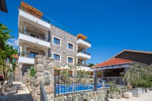 a building with a pool in front of it at Villa President 3 in Krimovice