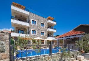 a hotel with a swimming pool and a resort at Villa President 3 in Krimovice