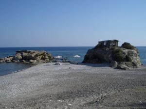 a house on a rocky island in the ocean at Corafili Holiday Suites in Kiotari +93 photos