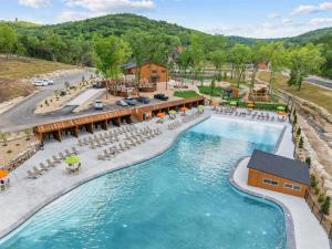 an aerial view of a pool at a resort at Lumberjack Lodge with Amenities in Hollister +52 photos