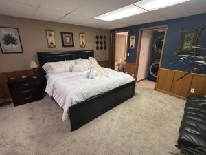a bedroom with a bed with a stuffed animal on it at TnTBnB in Combined Locks +49 photos