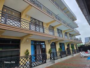 a building with balconies on the side of it at Hotel Datuna Aurum in Kobuleti