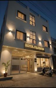 a hotel with a motorcycle parked in front of it at Hotel Pilgrrim in Varanasi