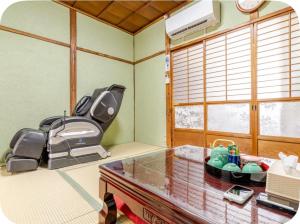 a room with a kitchen with a table and a chair at 2 floors japanese style, direct to KIX, 10mins train to Namba, 5mins walk to stn , 2-6ppl in Osaka
