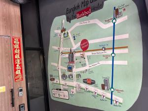 a map of the burj khalifa with a stop sign at BANKBED Hostel in Bangkok
