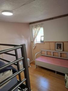 a bedroom with a bunk bed and a window at Navetta in Salo