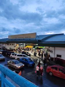 a group of cars parked in a parking lot at Hotel Sutera Maju in Kota Kinabalu