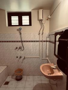 a bathroom with a shower and a sink at hello varkala beach view balcony resort in Varkala