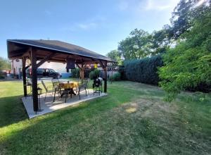 a gazebo with a table and chairs in a yard at U Melicherů in Suchdol nad Lužnicí