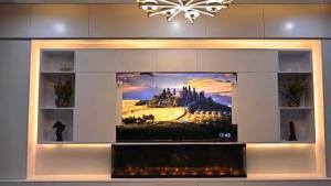 a tv in a wall with a painting on it at Meria town attock in Attock +7 photos