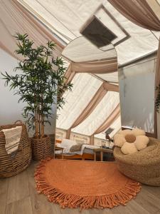 a room with a tent with a rug and a mirror at Evergreen Escape in Brush Prairie