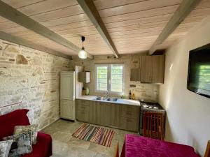 a kitchen with a sink and a stove at Mersini Village in Milonianá