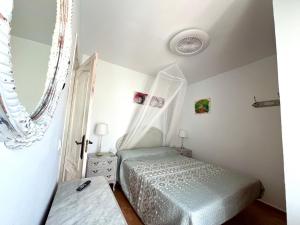 a bedroom with a bed with a canopy at Casa Maena in Cómpeta