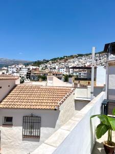 a view of a city from the roof of a building at Casa Maena in Cómpeta