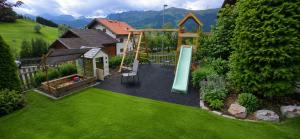 a backyard with a playground and a slide at Haus Alpenpanorama in Fendels