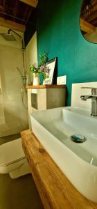 a bathroom with a white sink and a toilet at W ładnym polu n1 in Ruciane-Nida +44 photos