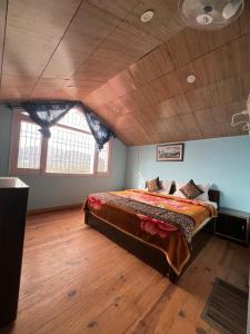 a large bedroom with a large bed in a room at THE PINE STAy in Chail