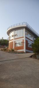 a large building with a round top at Wonderville Ensuite Rooms in Cuncolim +5 photos