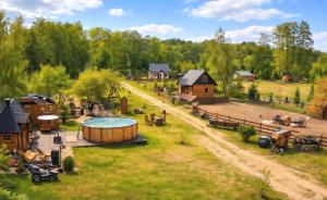 an aerial view of a farm with a hot tub and buildings at Casa Del Campo 1 in Gaśno