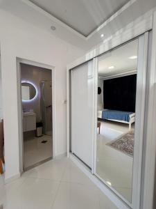 a room with a sliding glass door leading to a bedroom at Vengo Apartments in Kotor