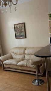 a living room with a couch and a table at Аркадия, Генуэзская in Odesa +1 photo