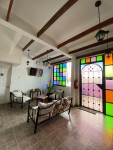 a room with a couch and a colorful door at Hotel Andalucía in Arica