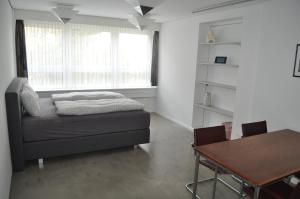 Postel nebo postele na pokoji v ubytování Loft AR
