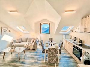 a living room with a couch and a table at Stonehouse Kotor Bay in Kotor