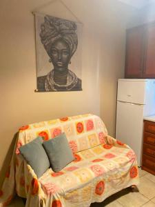 a bedroom with a bed with a bust of a woman at Calypso Rooms in Preveza