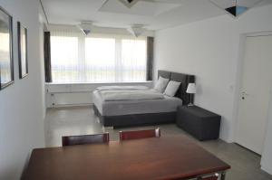 Postel nebo postele na pokoji v ubytování Loft AR