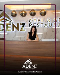 a woman sitting at a counter in a room at Adenz Otel in Elmadağ +10 photos