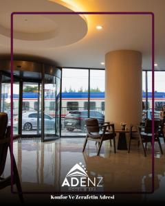 a lobby with chairs and a table in a building at Adenz Otel in Elmadağ