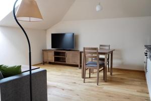 TV a/nebo společenská místnost v ubytování Mattone Aparthotel