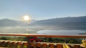 a view of a lake from a balcony at Sunčani Brijeg Eco Village in Plav +93 photos