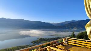 a view of a lake with clouds in the distance at Sunčani Brijeg Eco Village in Plav