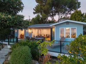 a house with a view of the backyard at Summerland SeaSpa Retreat | The Chosen Collection in Summerland