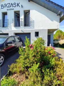 a car parked in front of a building at Brzask in Mosty +25 photos