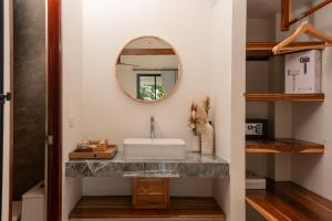 a bathroom with a sink and a mirror at Blue Sky Seaview in Haad Yao +32 photos
