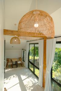 a room with a table and a large window at Blue Sky Seaview in Haad Yao