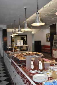 a buffet line with many different types of food at Hotel Soraya & Apartments in Lignano Sabbiadoro