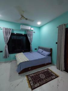 a bedroom with a bed in a room at Netra Kunj in Paliem +16 photos