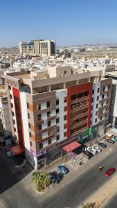 an aerial view of a large building with a parking lot at Diamond Tower Hotel in Jeddah