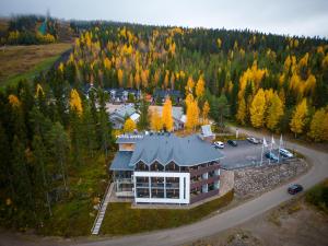 an aerial view of a building in the middle of a forest at Hotel Aateli Hillside in Vuokatti